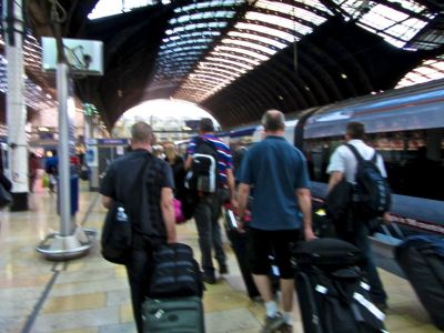 Getting off the train from the London Heathrow airport at London Paddington station