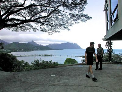 Me and the sellers real estate agent at the top of the driveway of the new house on Lulani Street in Kaneohe Hawaii. I must have said something snippy