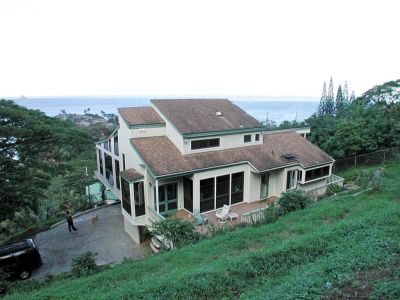 the back of the lulani house from a short amount up the back yard