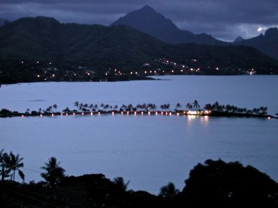 at night, when the tiki torches were lit on the edge of the fish pond