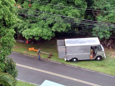 so the county of hawaii wanted to put in traffic calming 'speed table' right in front of the house because someone was killed 4 years before checking her mail in the middle of the street at 3 am in the dark.  after major fighting they put in a test speed bump,  the first day the sign went up, these guys backed over it