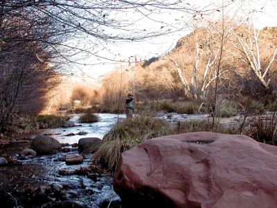 chris fishing in oak creek behind the house