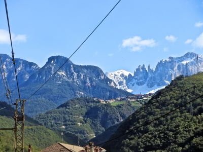 The dolomites , the town of castelrotto in front