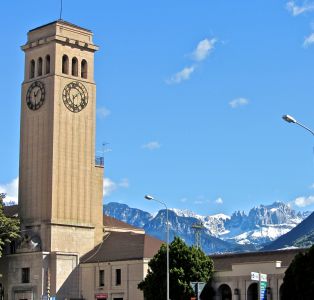 A view back at the train station with the dolomites in the distance